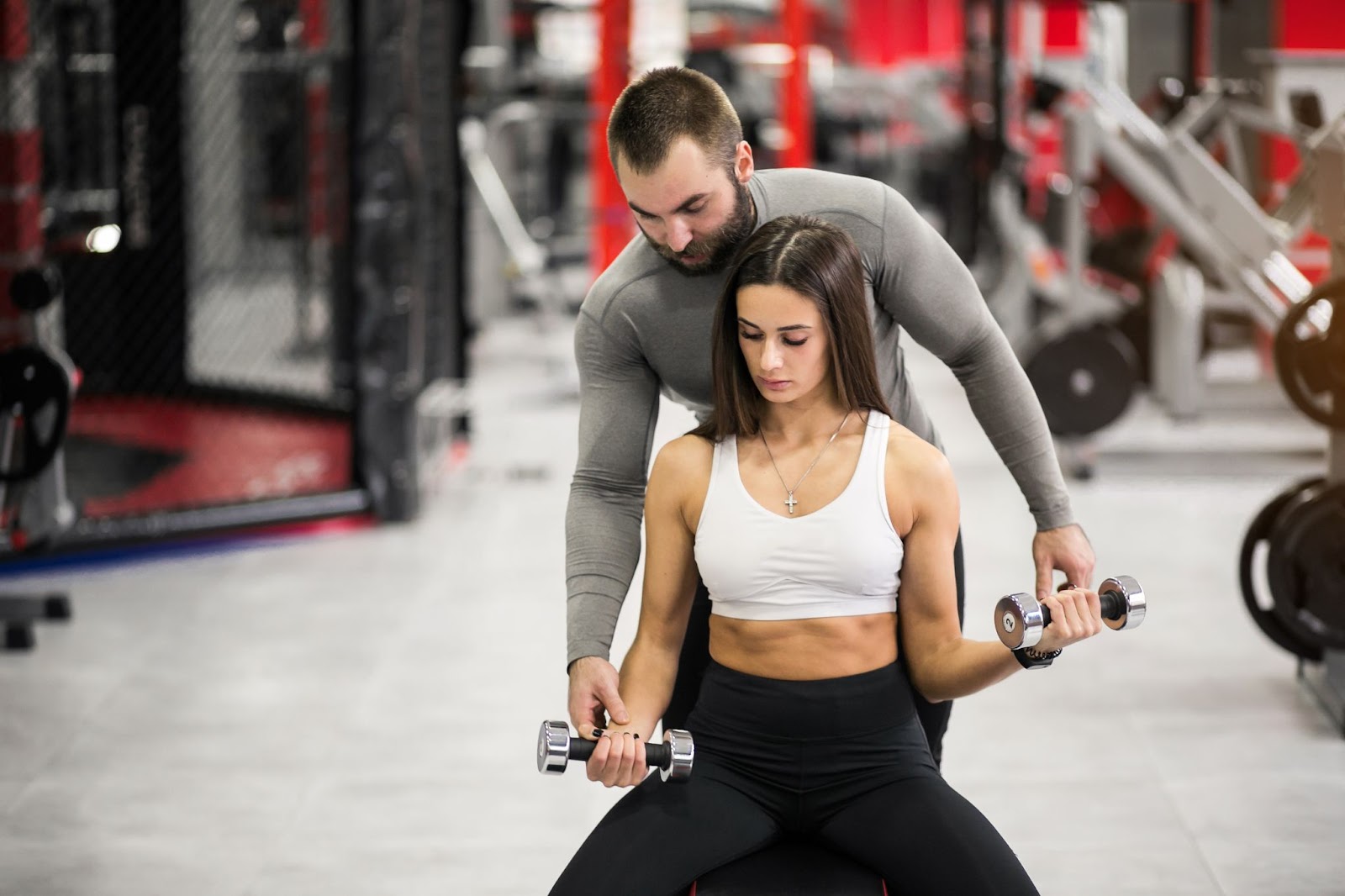 girl-with-her-gym-instrutor