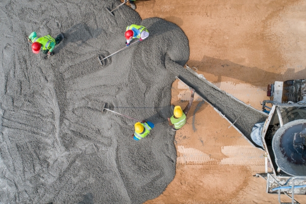 construction-worker-pouring-wet-concrete-road-construction-site