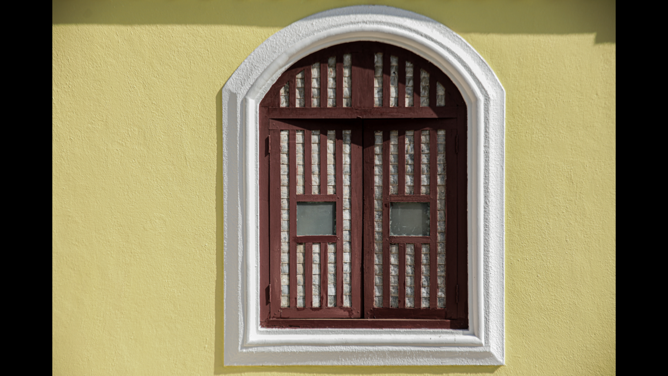 window of a house of Goa closed up with white oyster or mother of pearl shells