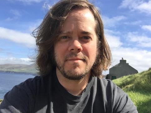 A person with long hair
Description automatically generated with low confidence