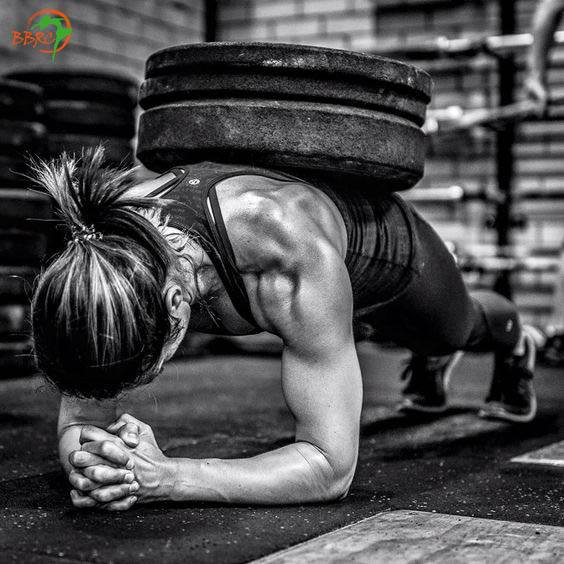 woman planking with weights