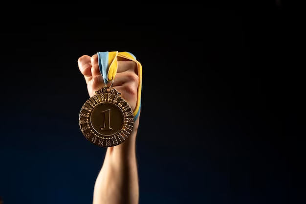 male athlete holding a medal