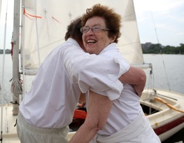 Meybaum gave Polly Penney a hug after giving her a sailboat ride around Lake Calhoun in Minneapolis.