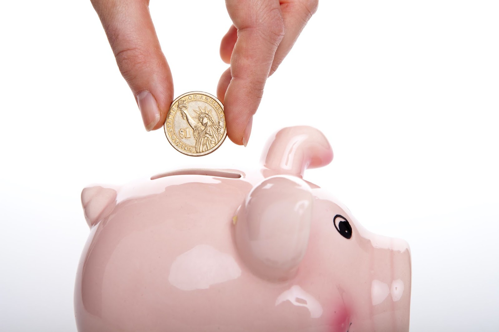 Piggybank receiving the savings from these small business marketing tips