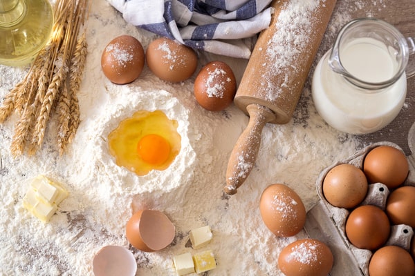 Basic ingredients for making a cake: eggs, flour, butter, milk, and oil