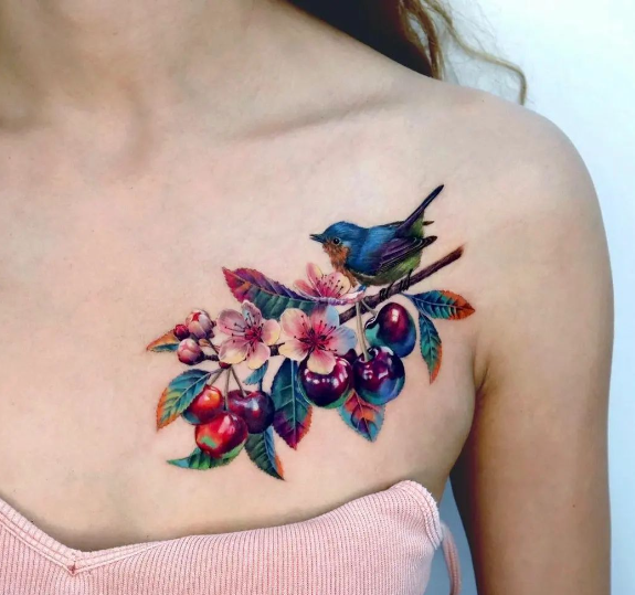 Cute Little Bird And Cherries Chest Tattoo For Women