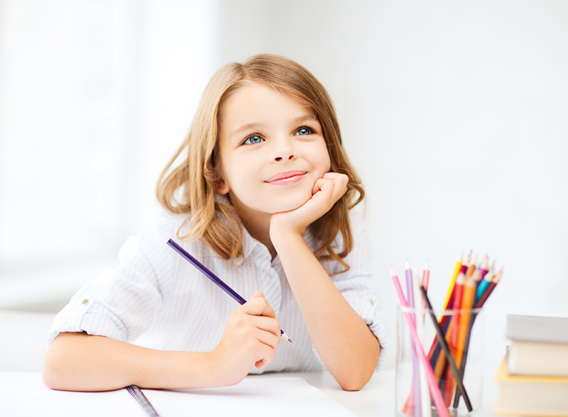 Young girl learning verbs for kids