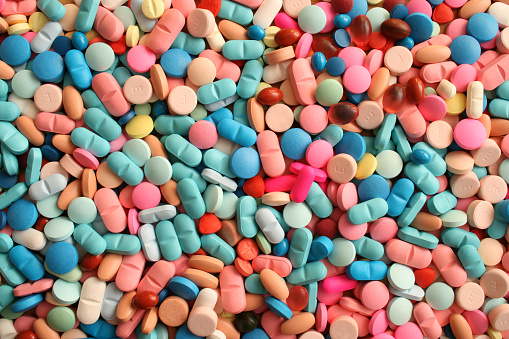 Different kinds of pills in a variety of colors