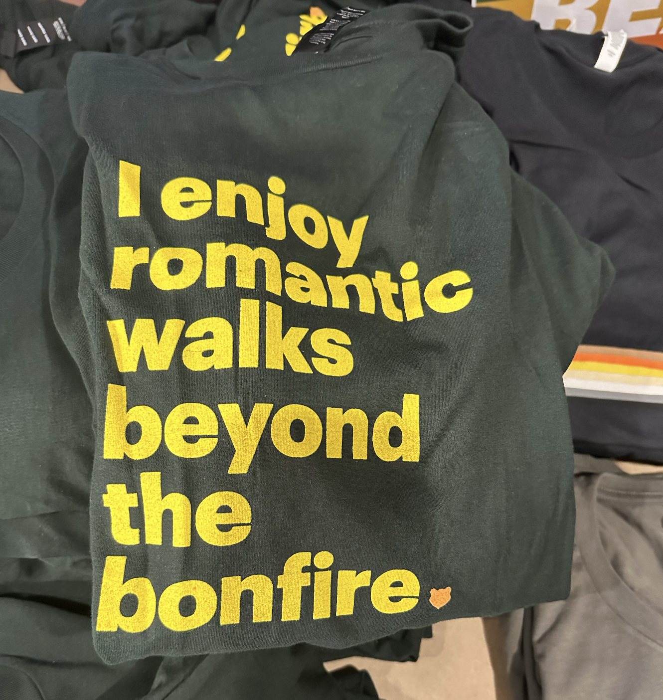 t-shirt reading i enjoy romantic walks beyond the bonfire