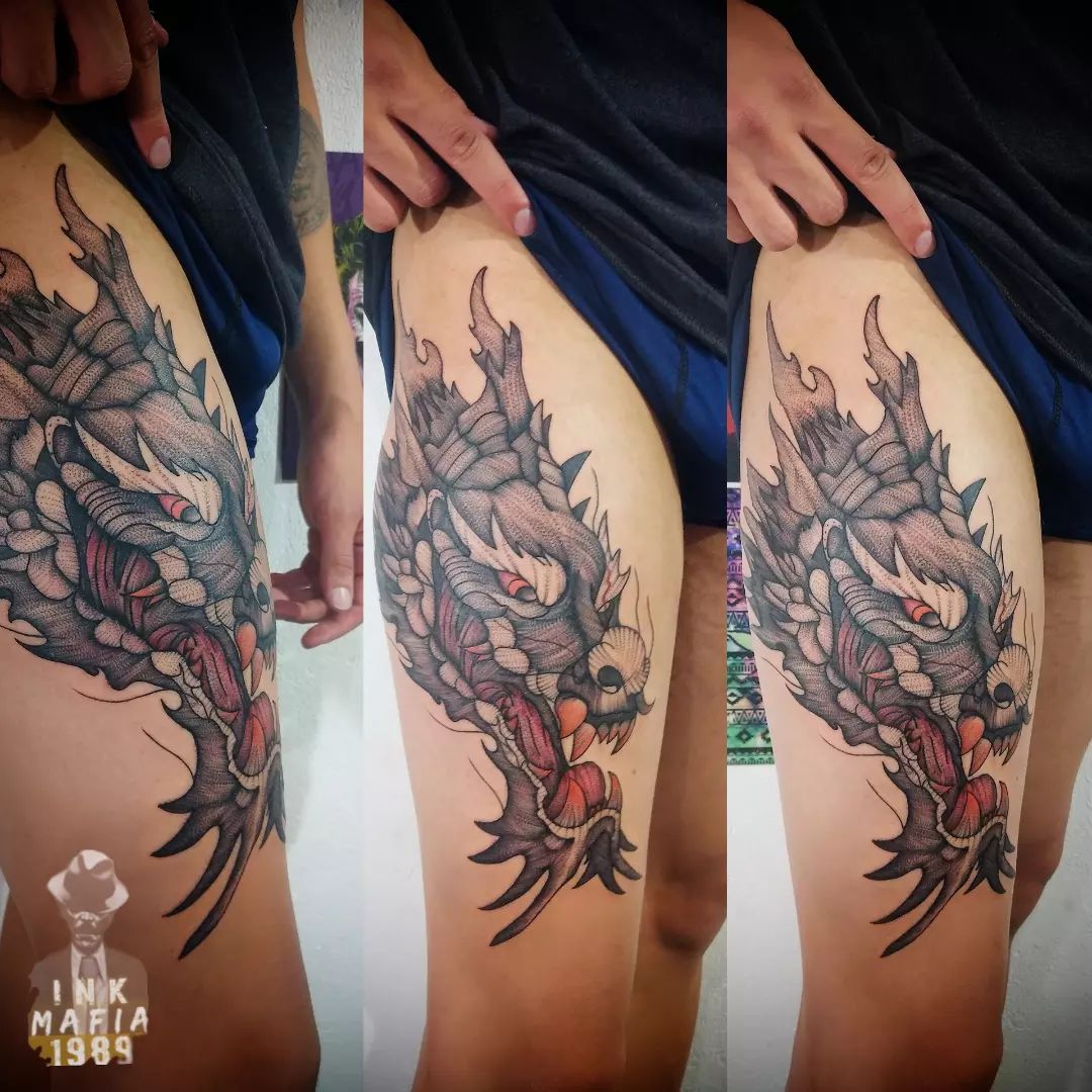 Dragon thigh tattoo