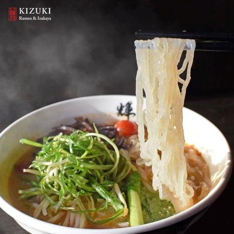 May be an image of chow mein and text that says 'KIZUKI Ramen Izakaya'