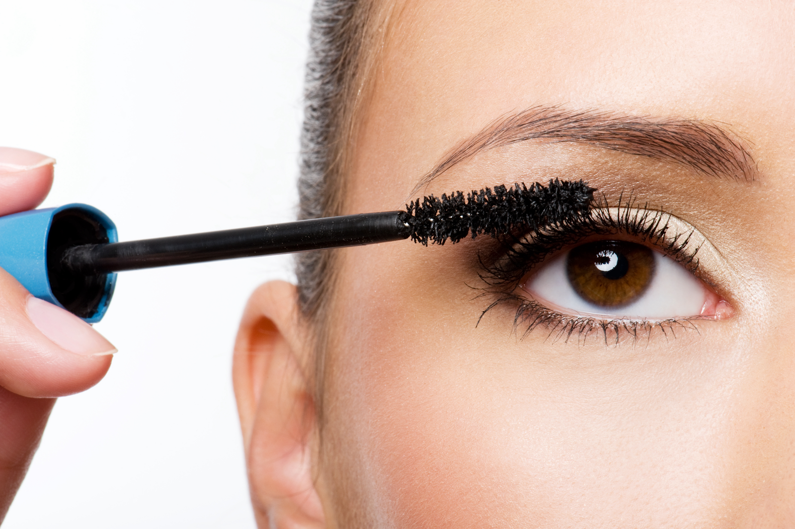 Apply a coat of clear mascara before using regular mascara.
