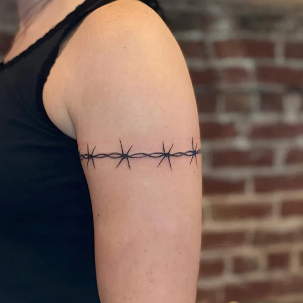 Close up view of the arm barbed wire tattoo