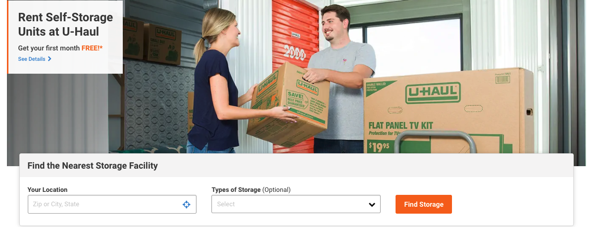 Screenshot of U-Haul self-storage website with a man and woman loading boxes into a storage unit.