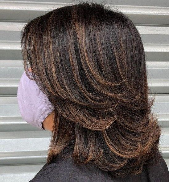 a lady on face mask showing her wispy layers