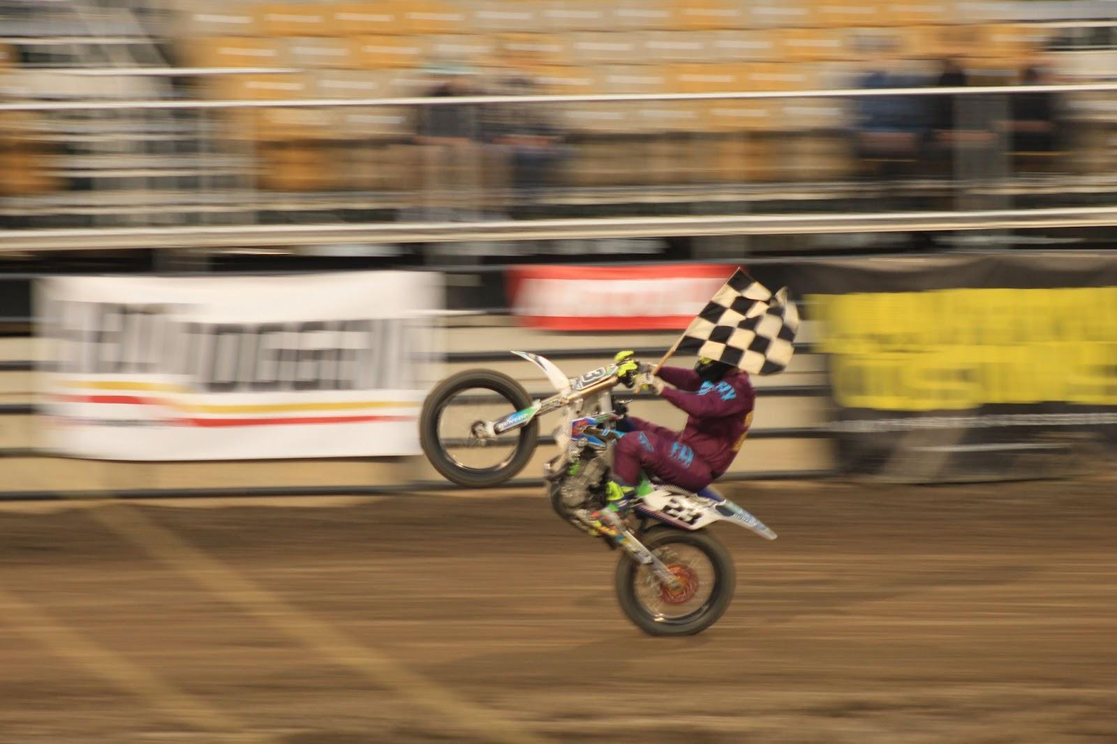 A person riding a motorcycle

Description automatically generated with medium confidence
