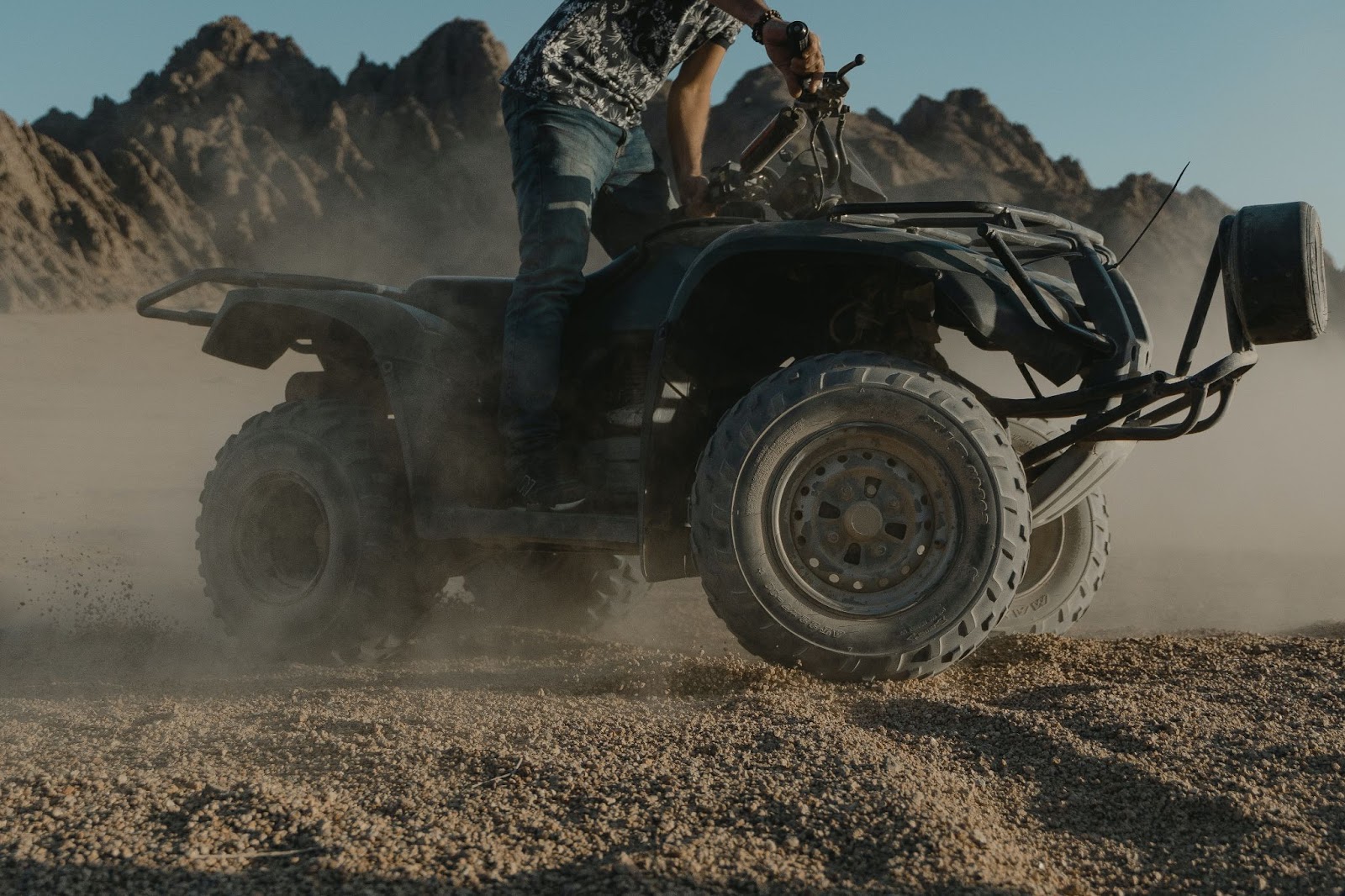 A person riding an ATV.