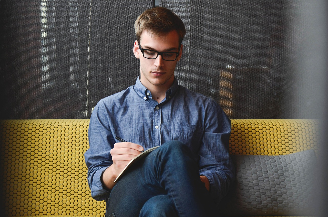 a man taking notes