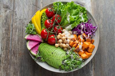 A Vibrant, colorful complete salad with all the food groups