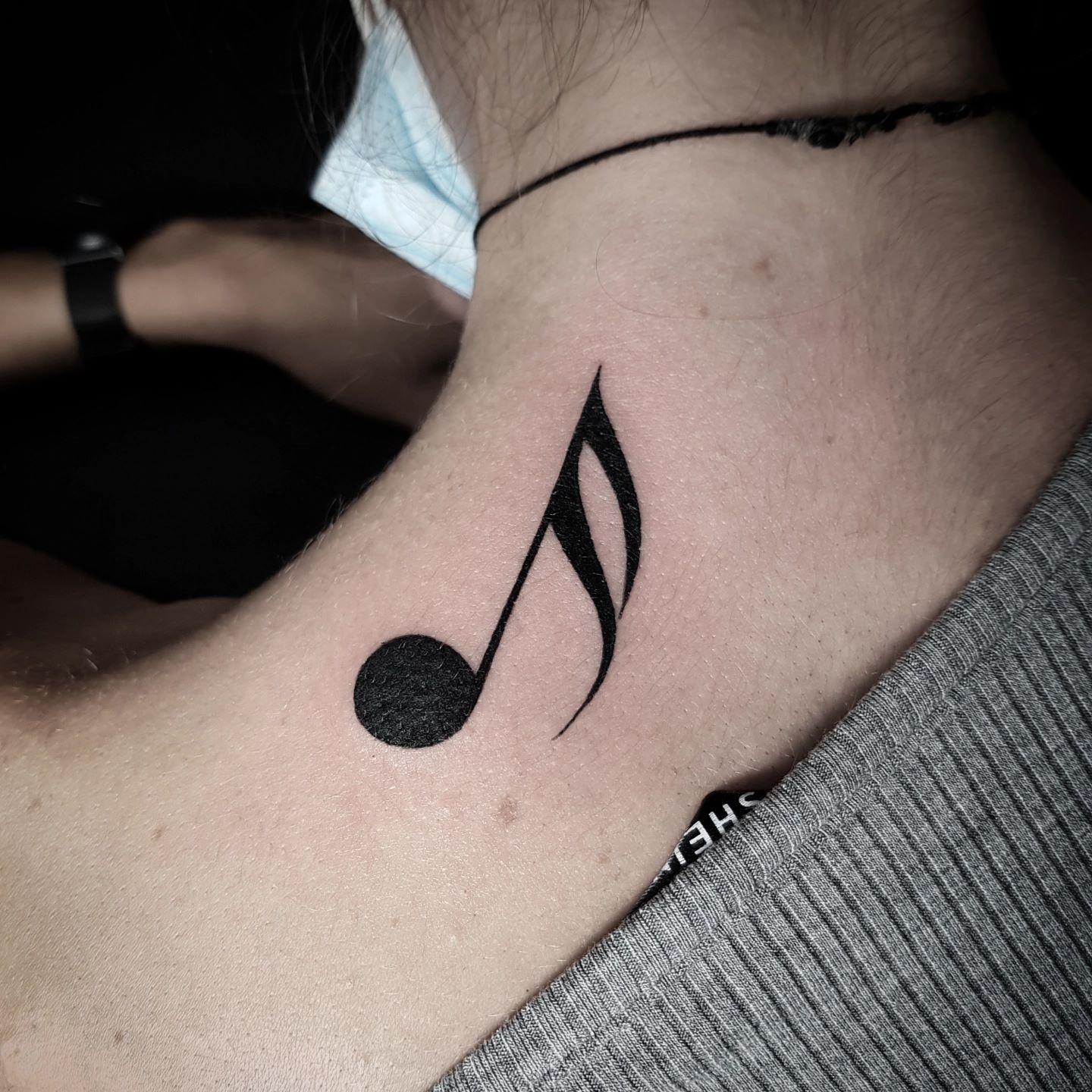 Music Note Tattoo on Collar Bone