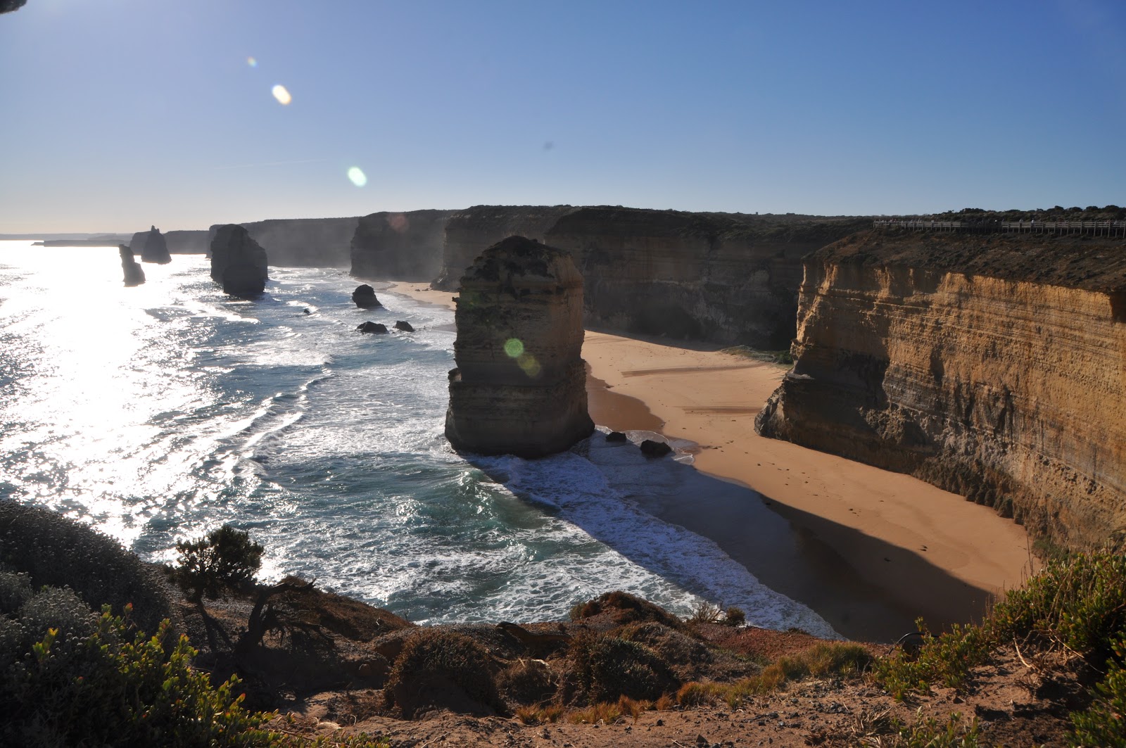 twelve apostles limestone cliffs near ocean coast small waves on a clear summer day in australia