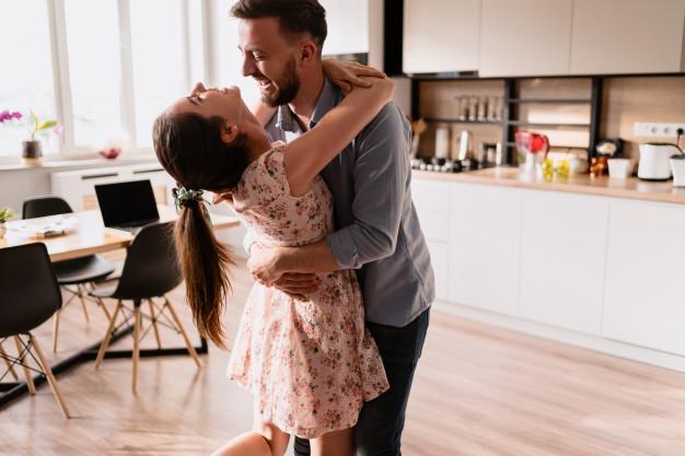 Man and woman dancing in a modern interior Free Photo