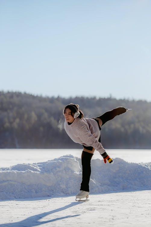 Woman Ice Skating on Snow
