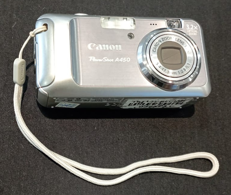 ¿ Máquina fotográfica digital, modelo Power Shot A-450, marca CANON  A peça foi utilizada pela seção de Mandados Judiciais até o ano de 2011, adquirida em 2007.     ¿
