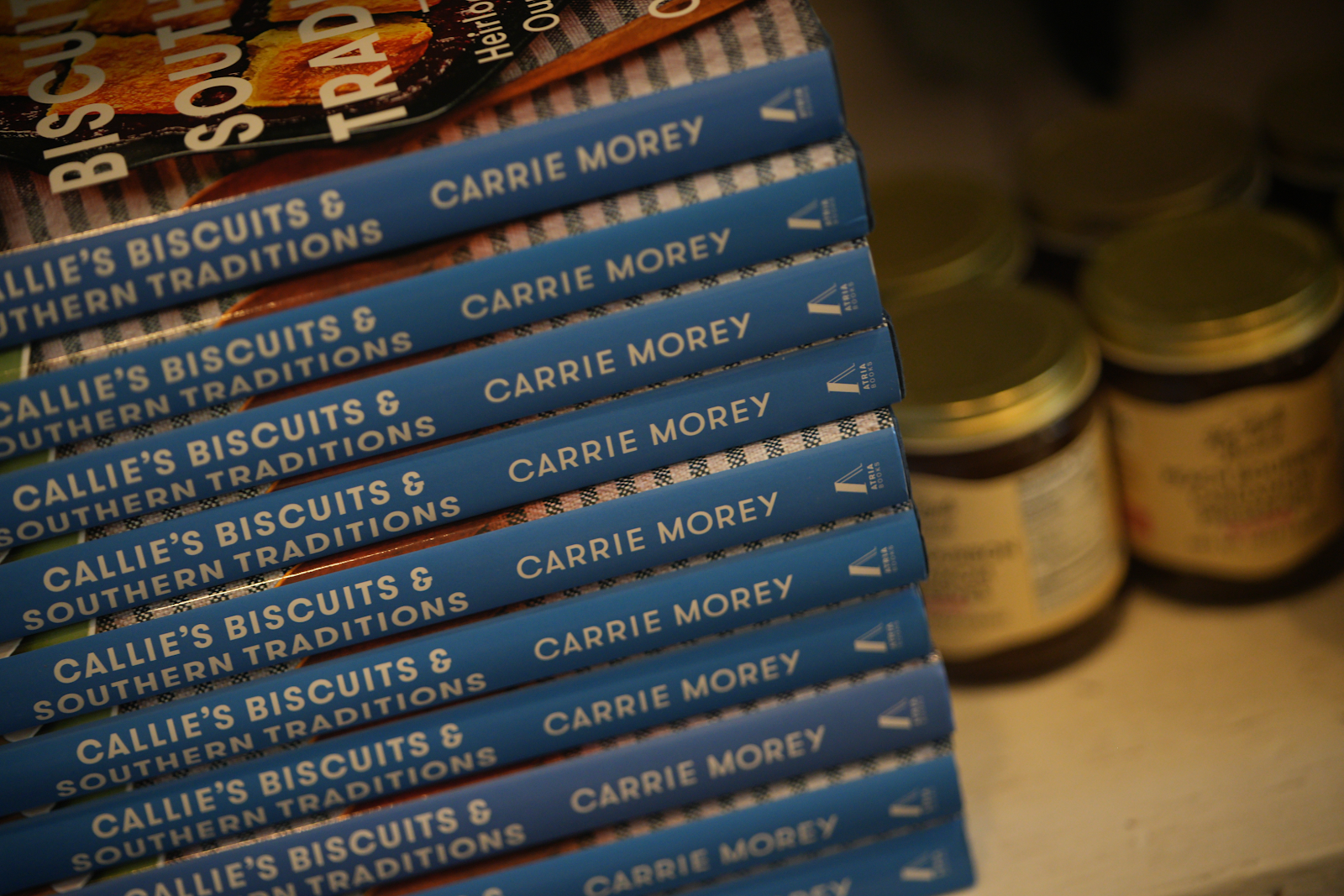 A stack of cook books from Carrie Morey, owner of Callie's Hot Little Biscuits