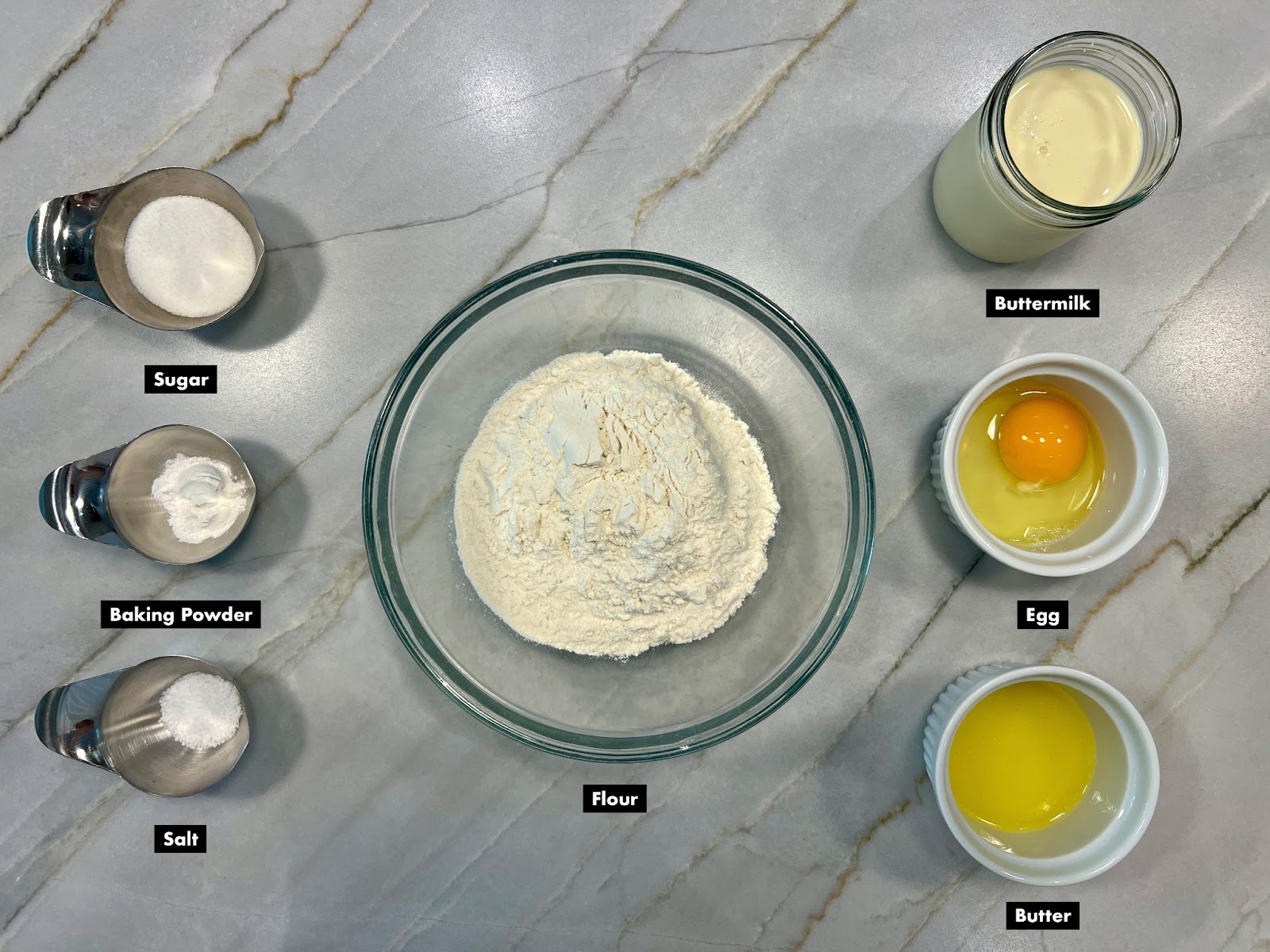 all the ingredients for buttermilk pancakes measured and portioned