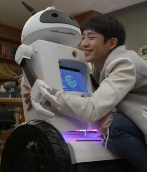 Robot being hugged by Jung Hae In
