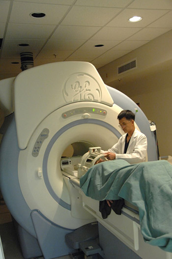 Image of a doctor and patient using an MRI.
