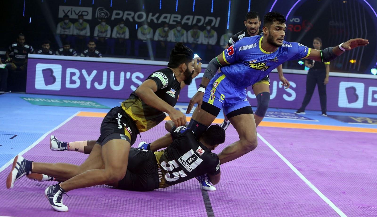 Telugu Titans defenders in action