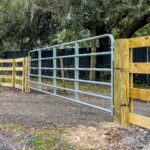 Photo of swing gate on wood 4-rail fence in Tampa Florida by Elite Fence & Outdoor