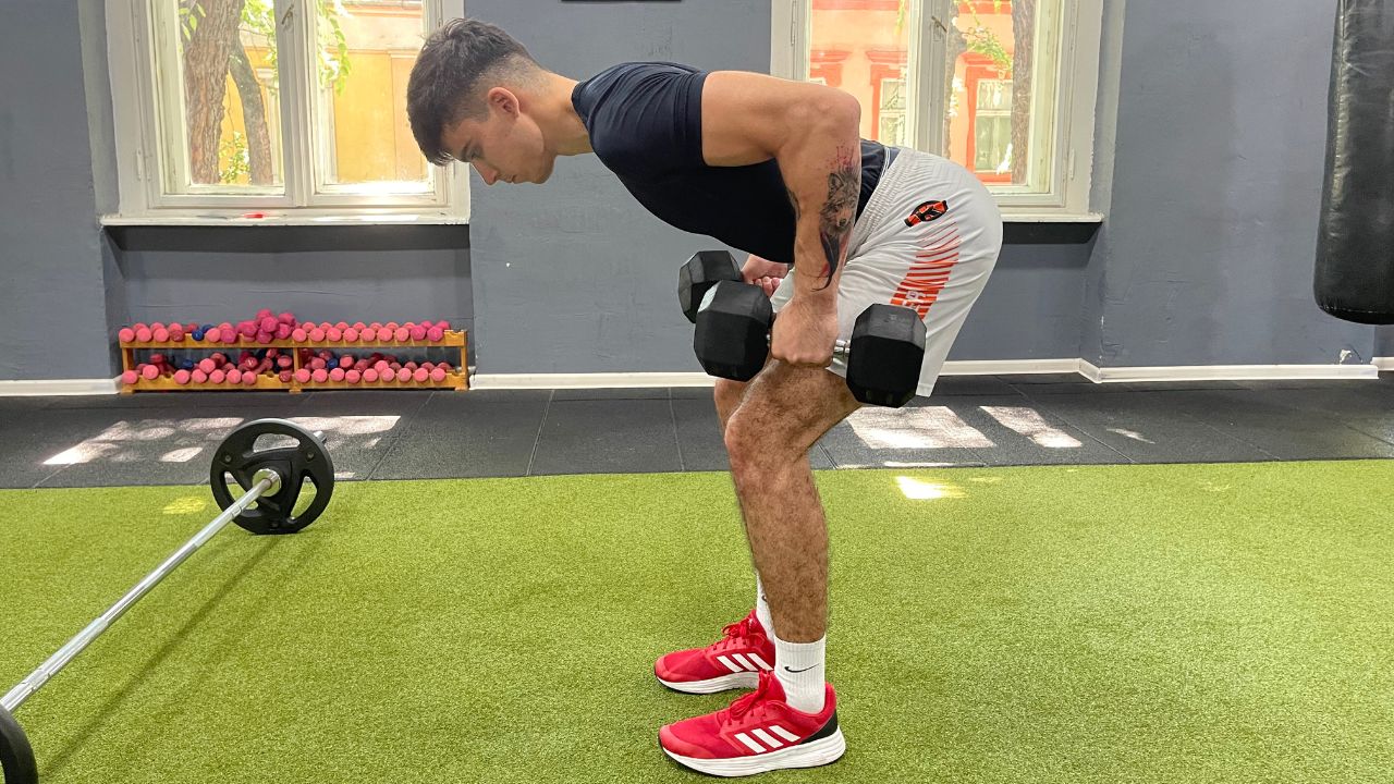 Vanja performs bent over two-dumbbell rows with palms in.
