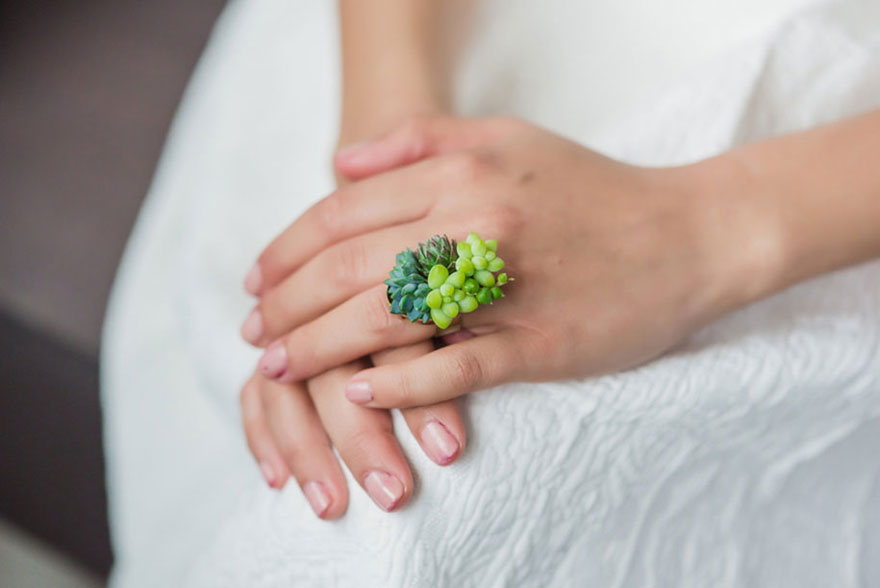 Succulent ring on woman's finger