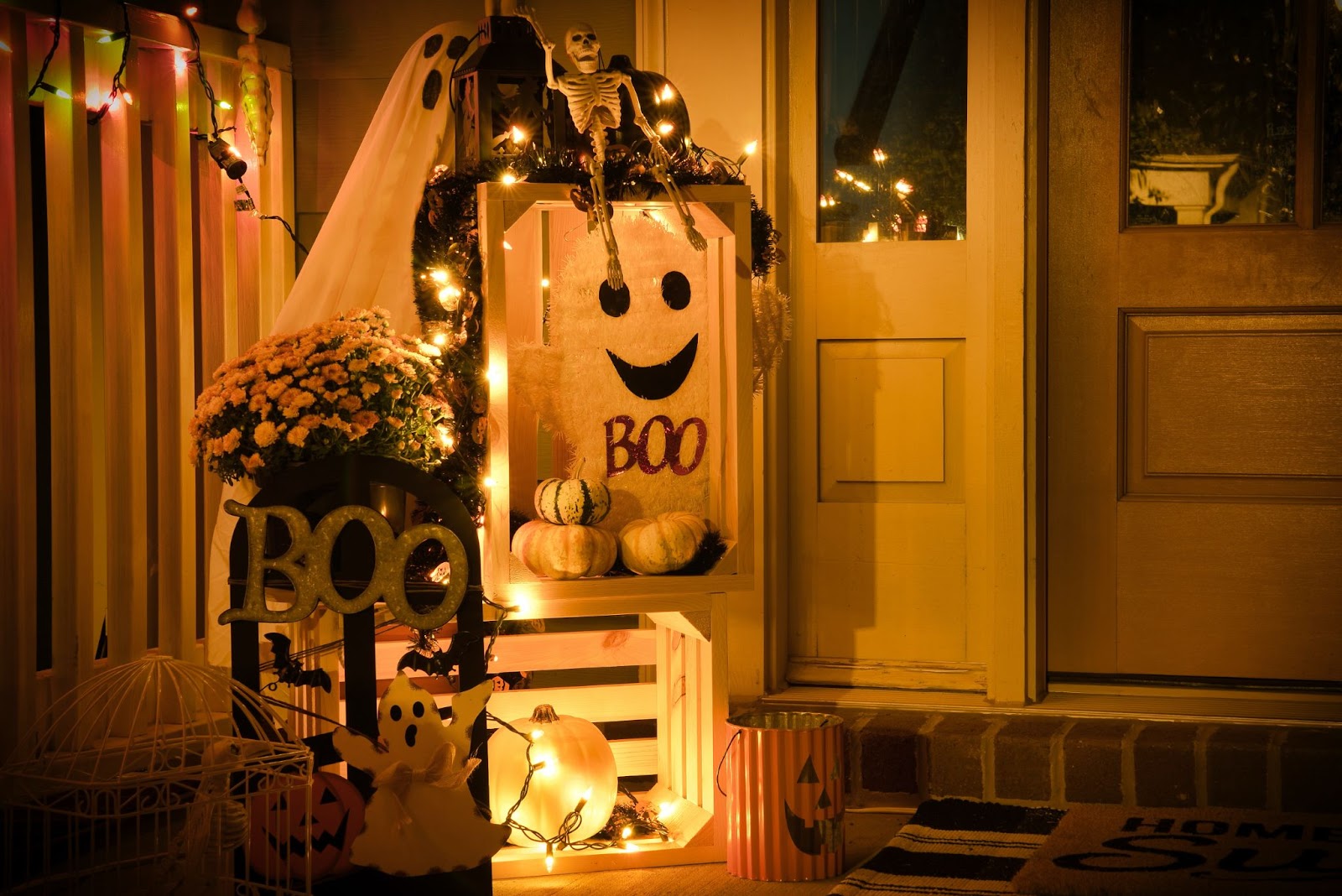 Halloween decorations and fairy lights on a front door step