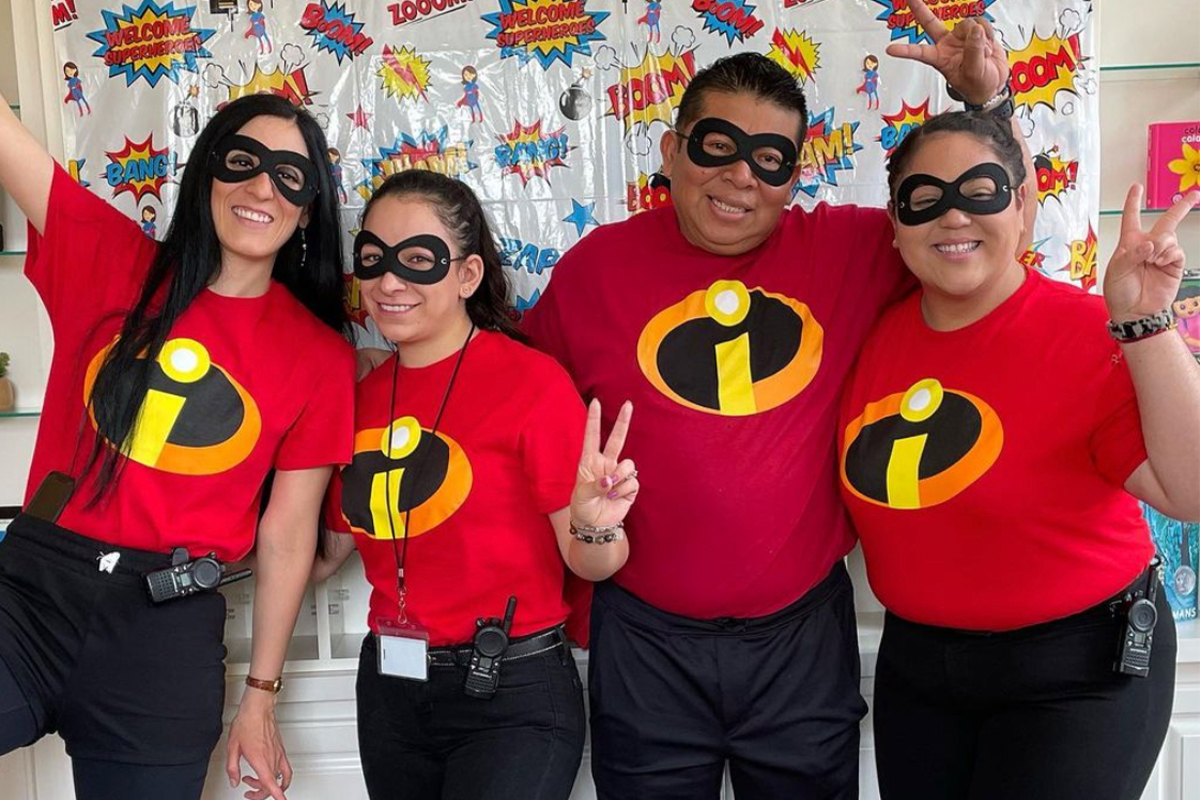 Sharon, Edina's Center Director, taking a picture with her administrative team.