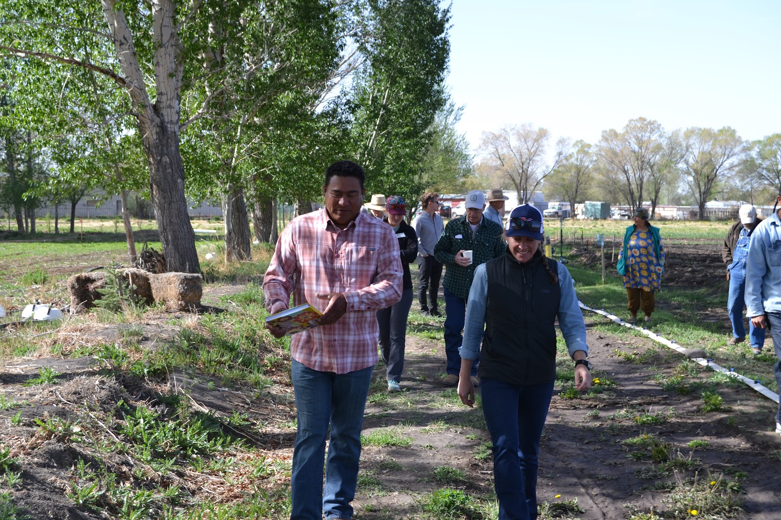 Community members walking along path at park