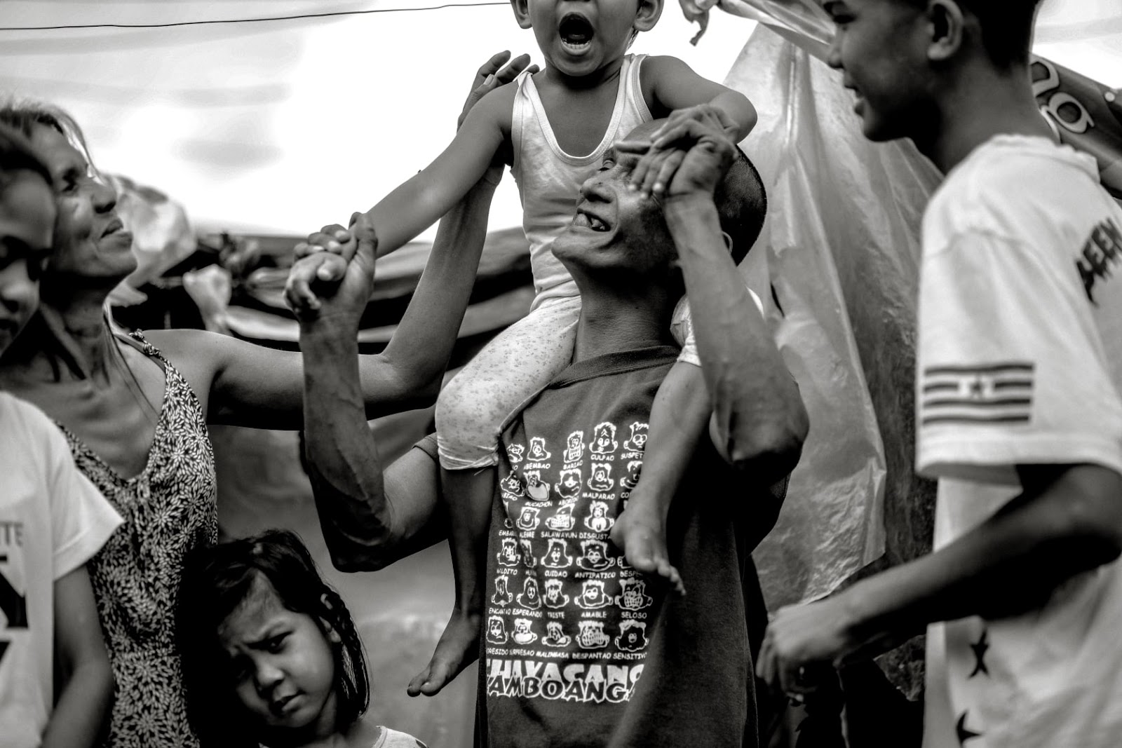 Rommel and Rosalyn live in a shack in an empty space of land with their six children. 