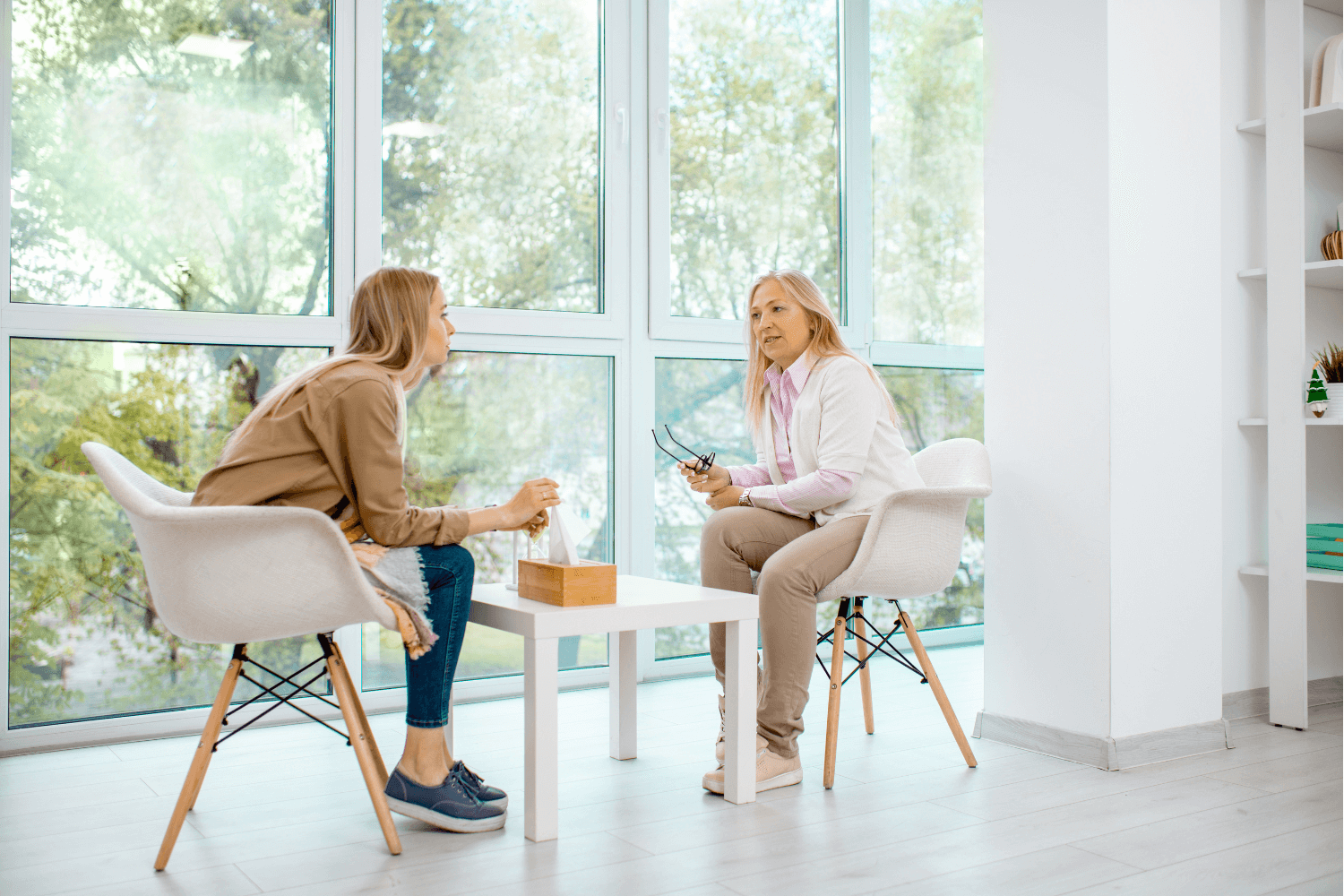 Woman sitting across from a counselor during a counseling session