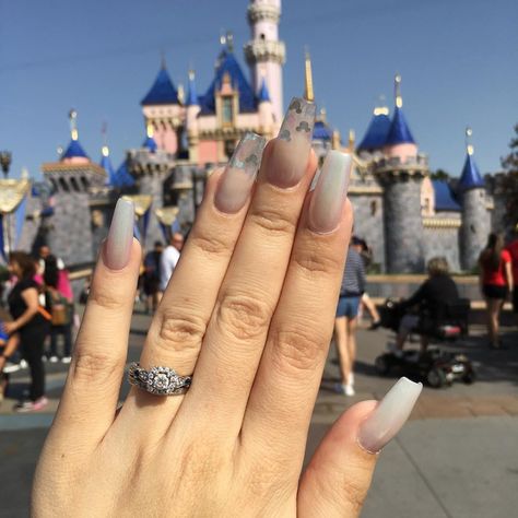 Add some faith, trust, and pixie dust to your fingertips. Your nails will look magical with holographic Mickey Mouse ears and a pearl and ombre sheen! 
