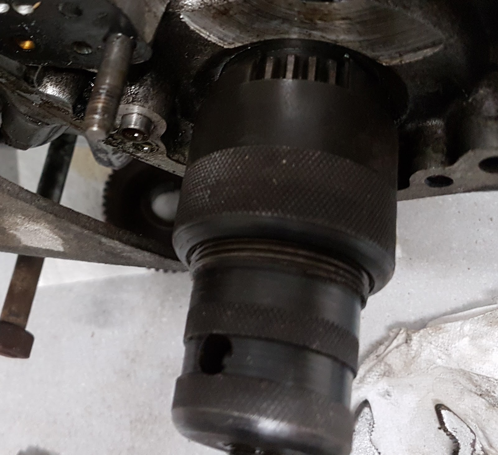 The crankshaft pinion being removed from the Bonneville.