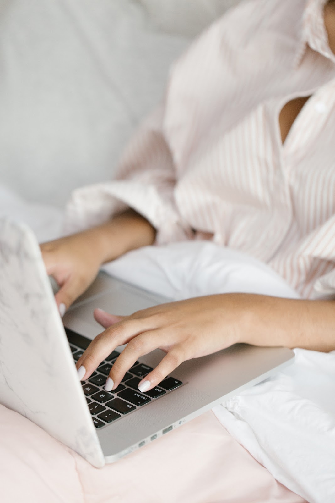 Woman typing on laptop, remote work, virtual work
