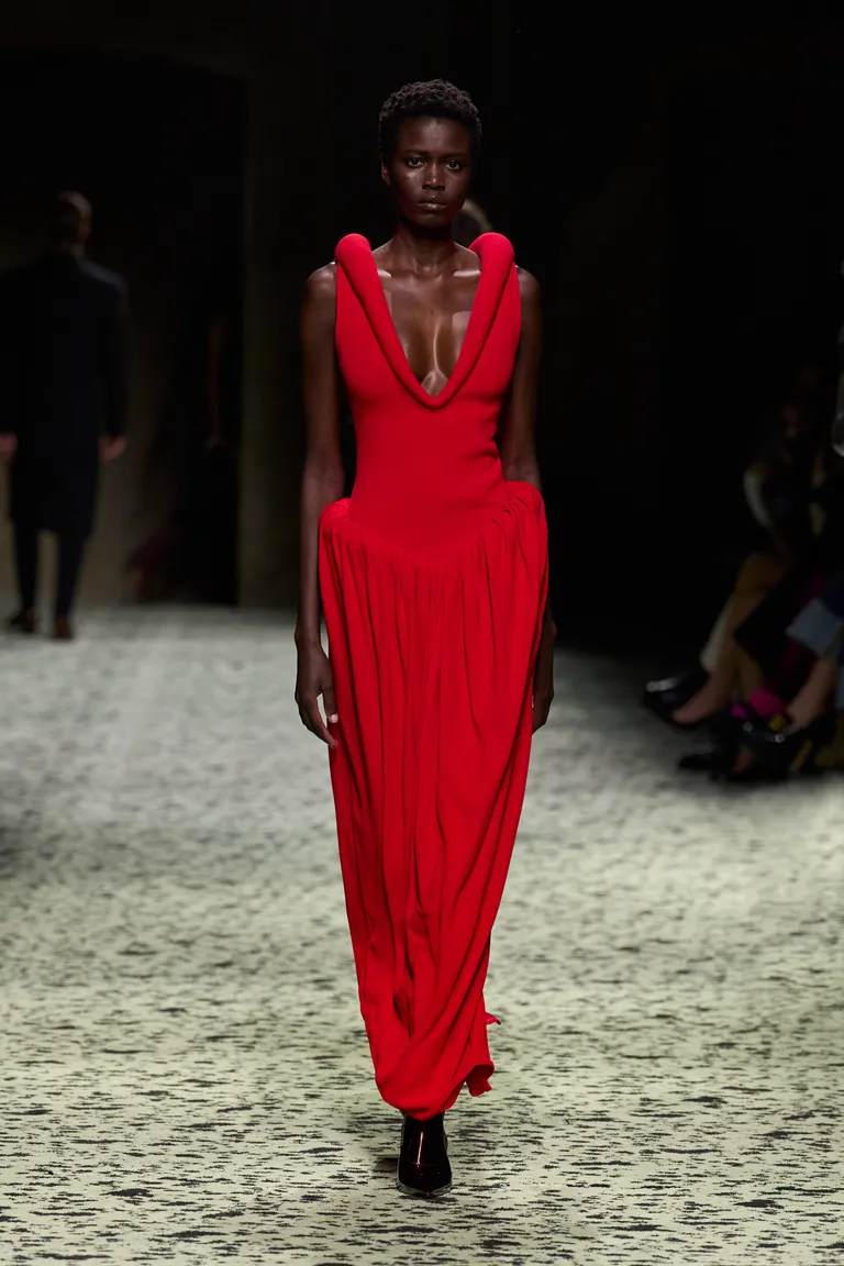 Beautiful black  model in red rocks the runway