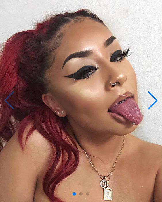 Gorgeous lady shows off her snake her piercing