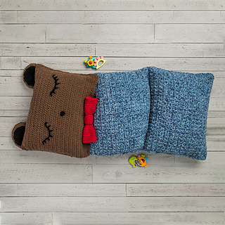 large crochet floor pillow that looks like a bear