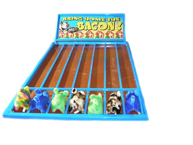 The Bring Home the Bacon Carnival Game is played by having each of the 7 players pick a pig in a lane, once the gate is lifted the pigs race to the end the first one to get there wins! 