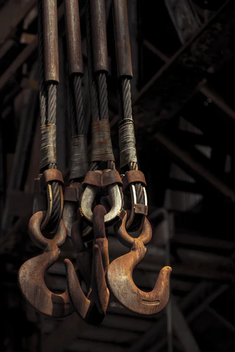 Four large metal hooks