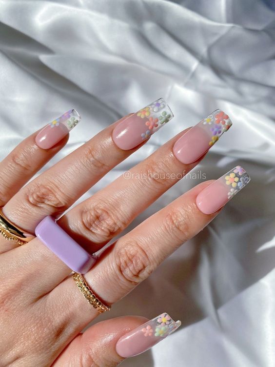 Long acrylic nails with flower as french tips